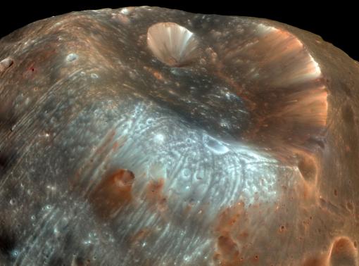 A mysterious little rock in its own right - The Martian moon Phobos has accumulated dust and debris from the surface of Mars, knocked into its orbital path by projectiles colliding with the planet. A sample-return mission to Phobos would thus return material both from Phobos and from Mars.