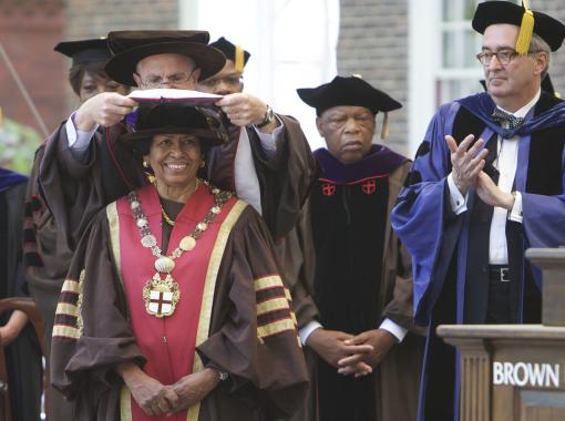 Te Doctorem Humanarum Litterarum salutamus - Chancellor Thomas J. Tisch places the doctoral hood on the shoulders of Ruth J. Simmons, 18th president of Brown University.