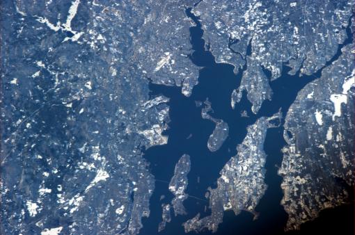 Rhode Island on a clear day - Commander Ford photographed Narragansett and Mt. Hope bays from the International Space Station. His adult kids watched him fly by from the Ladd Observatory, near the top edge of the photo, just right of center.