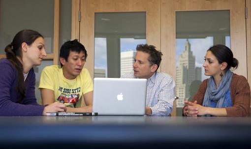The sum of its parts - A new computer program that analyzes the frequency and position of certain short DNA sequences helps researchers find sequences likely to be involved in gene splicing. The team, from left: Luciana Ferraris, Kian Huat Lim, William Fairbrother, Madeleine Filloux.