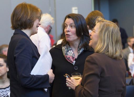 Teaching, Research, Impact - President Christina Paxson chats with Lt. Gov. Elizabeth Roberts, center, and inaugural lab co-chair Elizabeth Burke Bryant of Rhode Island KIDS COUNT at a gathering to celebrate the new TRILab program.