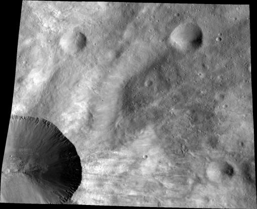 Canuleia up close - Dawn’s Low Altitude Mapping Orbit (LAMO) image of the crater Canuleia illustrates the interior of the crater and complex details of the fresh rays across the soil of the asteroid Vesta.