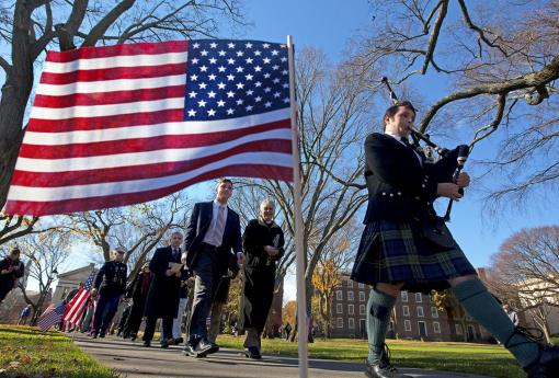 The debt we owe - Led by bagpiper Andrew Bower, the Veterans Day procession makes its way to Simmons Quadrangle from the College Green.