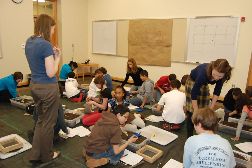 Getting their hands dirty: Middle schoolers sift through sand and dirt, looking for clues, trying to understand what the artifacts might mean. What they’re learning is how to think like an archaeologist.