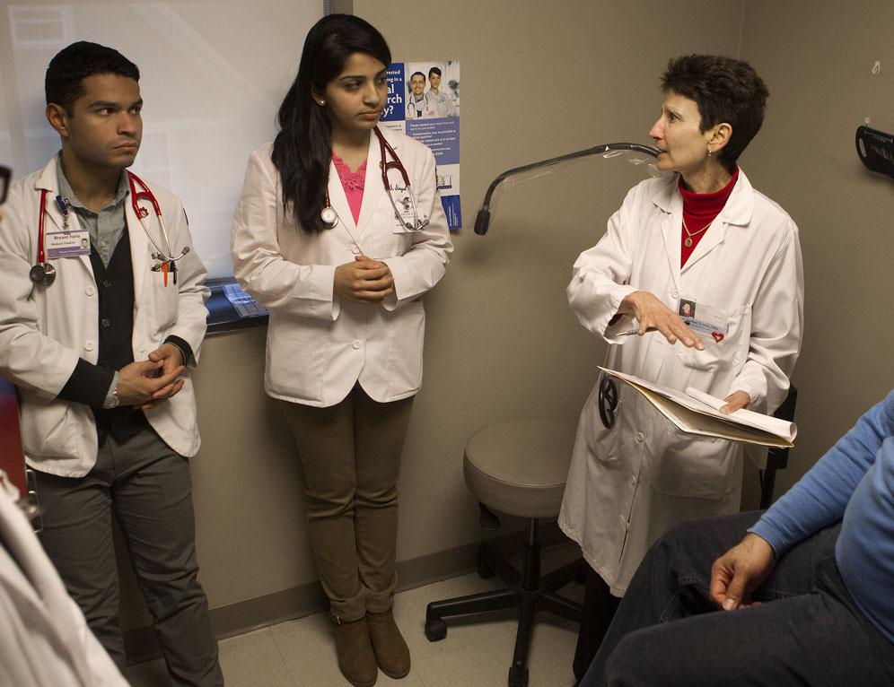 Student exams lead to a plan for care: Dr. Troise discusses discusses a course of action with medical students Sanchita Singal and Bryant Faria. “One of the best things about being a doctor is not writing a prescription,” she says, “it’s the bond you have with that person.”