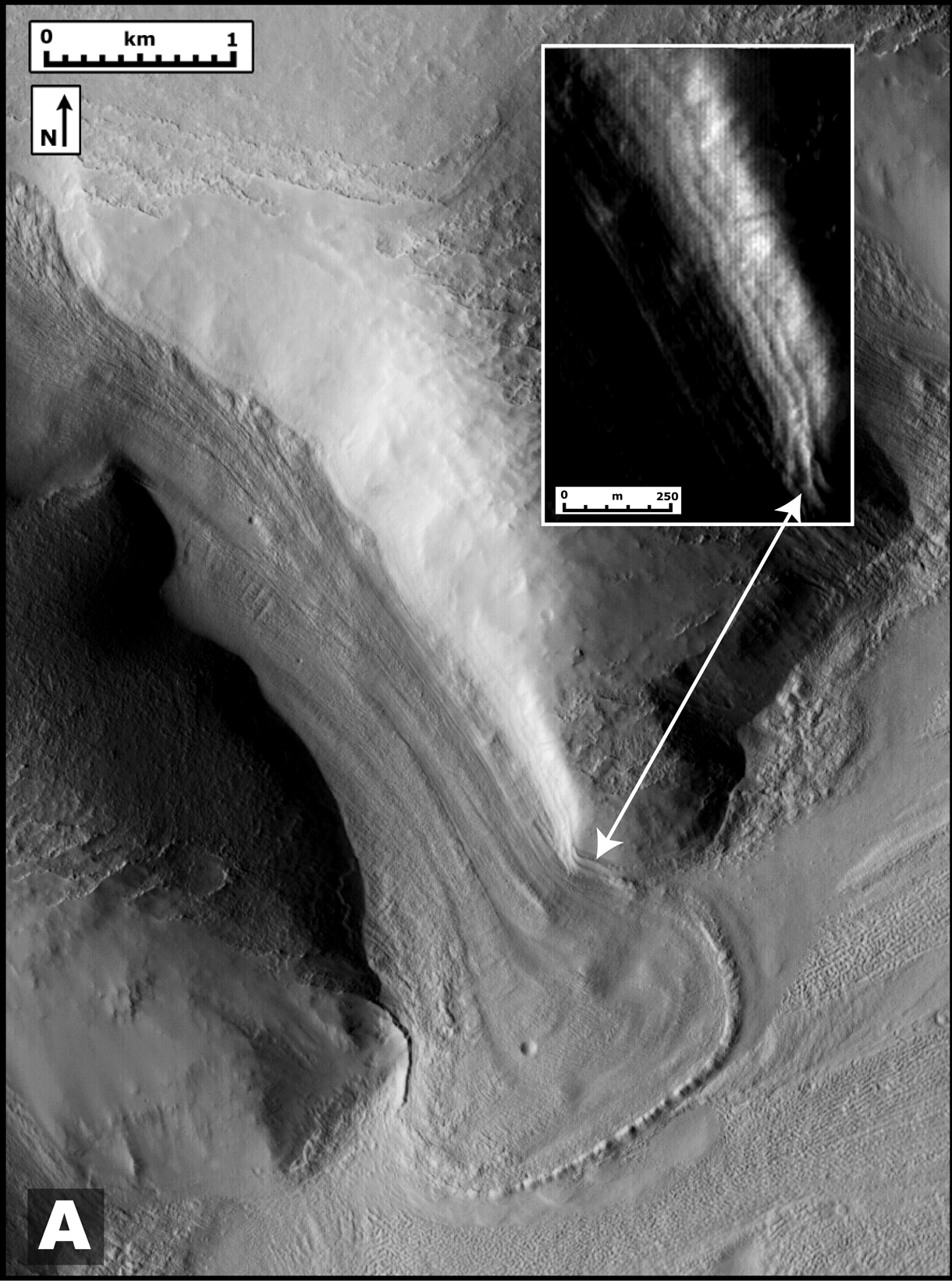 Ancient Martian Tributary: This image taken taken by the Mars Reconnaissance Orbiter shows a glacier-like lobe that had spilled from an ancient tributary on to the surrounding plain. Brown scientists report in May's issue of Geology that the lobe is superimposed on a past ice deposit and appears to be evidence of more recent glaciation.