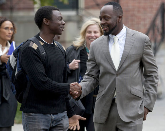 A new visiting fellow: Sophomore Bryan Maina greets Wyclef Jean on the College Green Monday. Jean accepted an appointment as visiting fellow in the Department of Africana Studies. (Download additional photos.)