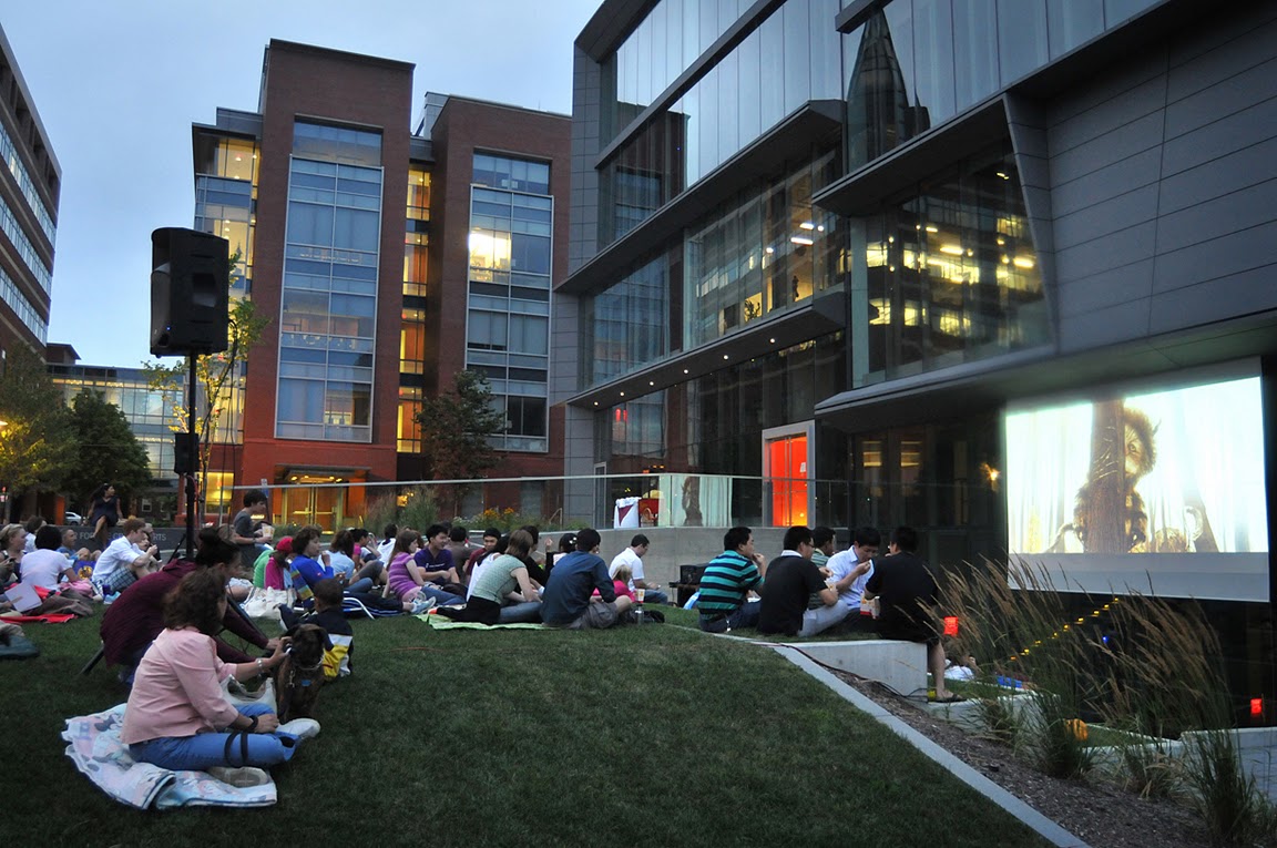 Best seats on the East Side: About 80 of the University’s neighbors spread out their picnic dinners and settled in for Brown’s inaugural movie night. On the big screen: Where the Wild Things Are.&nbsp;&nbsp;&nbsp;Credit: Frank Mullin/Brown University