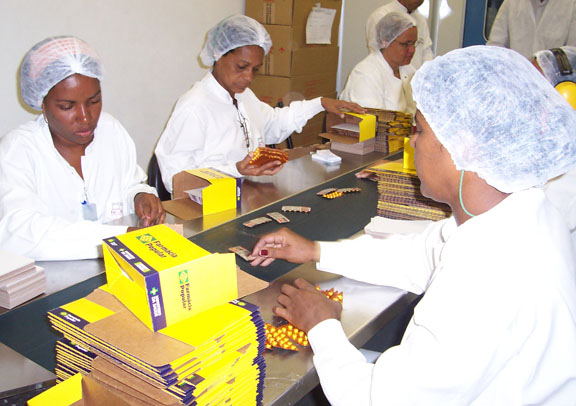 AIDS treatment in developing countries: Brazil pressed pharmaceutical companies to lower their prices and began producing AIDS medicines in public factories, as in this production line at Farmanguinhos.