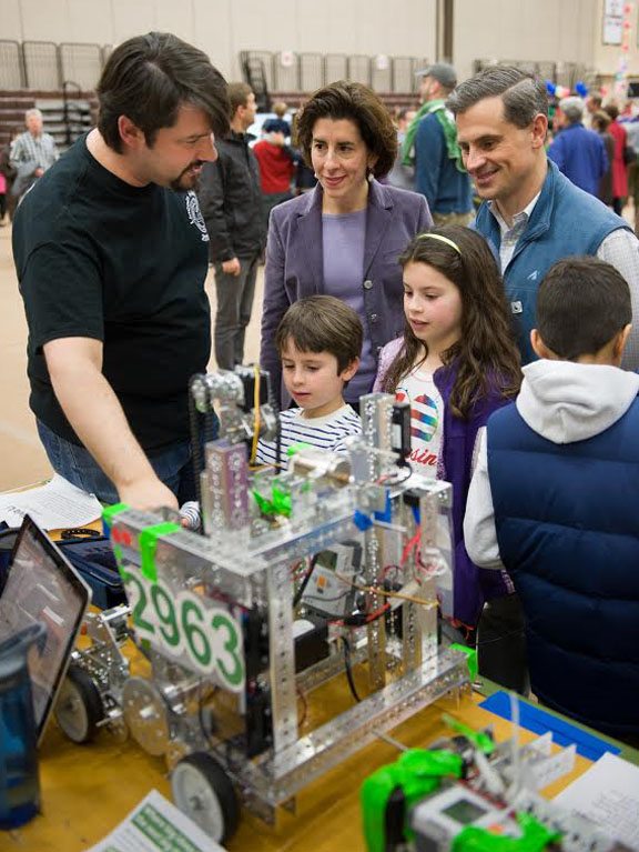 Coming soon to homes and schools near you: State Treasurer Gina Raimondo and family look at the inner workings of a robot. “Not everybody is going to be a roboticist,” says Brown’s Chad Jenkins, “but as these technologies develop, we’ll all be using them.”