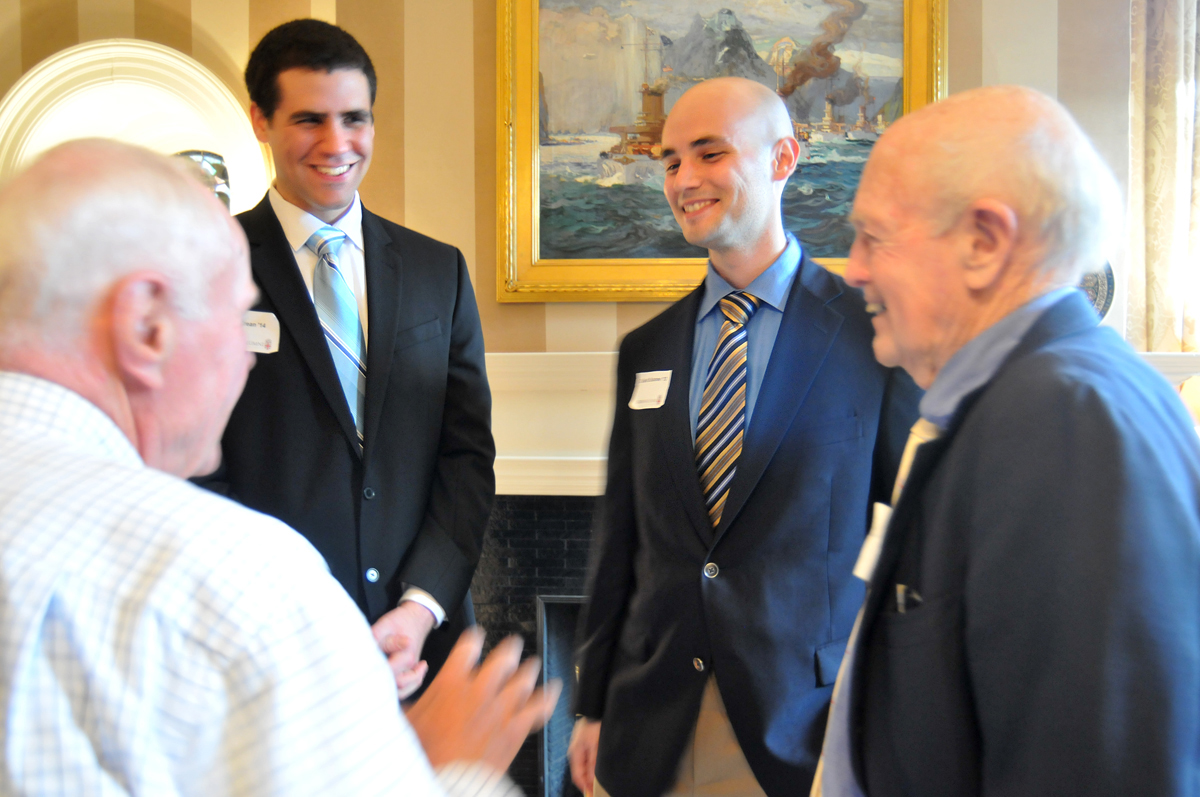 Common ground: Bill Meyer and Bill Monroe of the Class of 1950, foreground, traded military stories with Philip Crean ’14, David Salsone’13 at the Hope Club Thursday night. Credit:&nbsp;Frank&nbsp;Mullin/Brown&nbsp;University