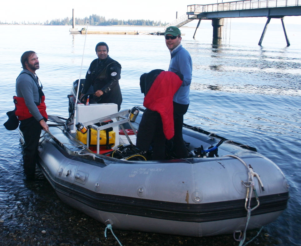 Sea hunt: Jon Witman, left, and Jim Palardy, right, prepare for a dive near Kasitsna Bay Marine Lab in Alaska with research assistant Dom Hondolero. The relationship between water flow and  diversity of marine life was observed in a wide variety of environments.