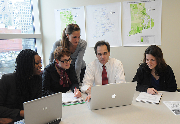 Mapmakers: Patrick Vivier and students in community health plotted lead poisoning, pre-1950 housing stock, and low-income households to help target cleanup resources. (Credit: Frank Mullin / Brown University)