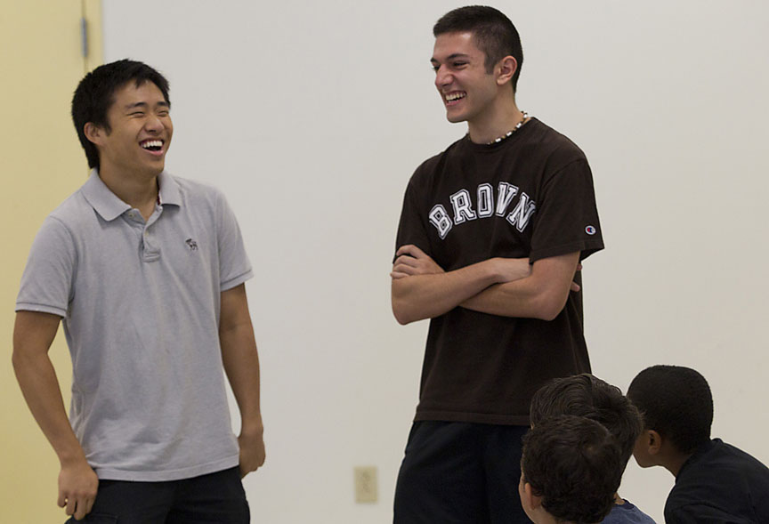 Keeping a step ahead: Instructors Raymon Baek, left, and Michael Lazos were surprised at how quickly students mastered material. In the final battle, the instructors’ own robot was thrown for a loss.