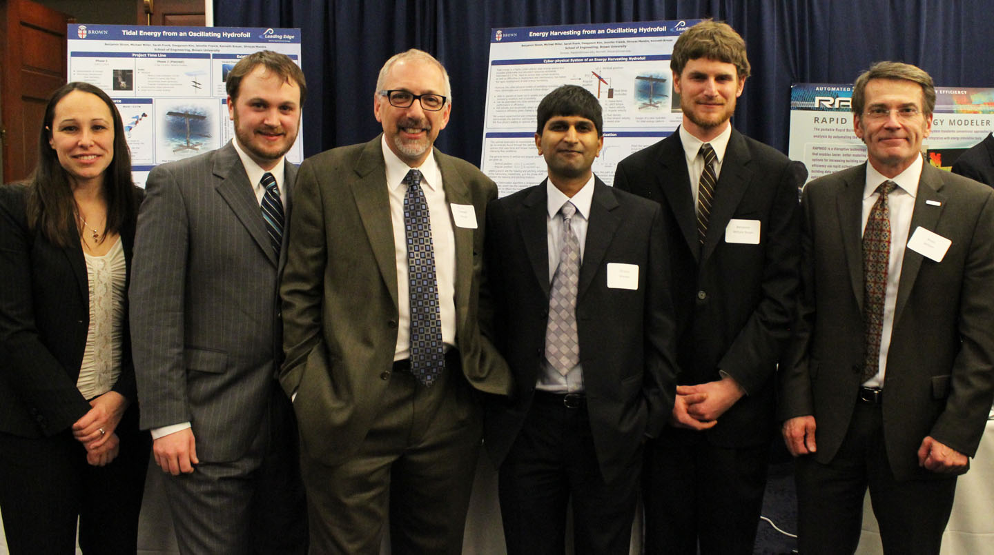 The hydrofoil team presents findings in Washington, D.C.: From left: Jennifer Franck, lecturer in engineering; Michael James Miller, grad student; Kenneth Breuer, professor of engineering; Shreyas Mandre, professor of engineering and team leader; Benjamin Strom, research engineer; and Bryan Willson, a program director at the Advanced Research Projects Agency-Energy (ARPA-E).