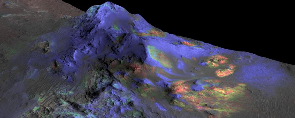 Researchers have found deposits of impact glass preserved in Martian craters like Alga (above) using data from NASA's Compact Reconnaissance Imaging Spectrometer for Mars (CRISM). Green indicates the presence of glass. (Blues are pyroxene; reds are olivine.) Such deposits could be a good place to look for signs of past life.