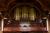 Mark Steinbach seated at the organ at Sayles Hall.